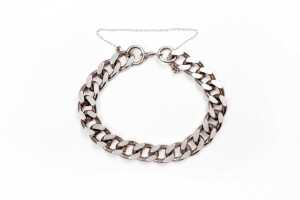 A curb link bracelet in sterling silver
