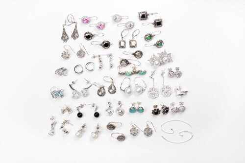 A large collection of earrings in sterling silver