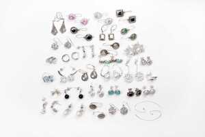 A large collection of earrings in sterling silver
