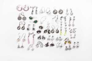 A large collection of earrings in sterling silver