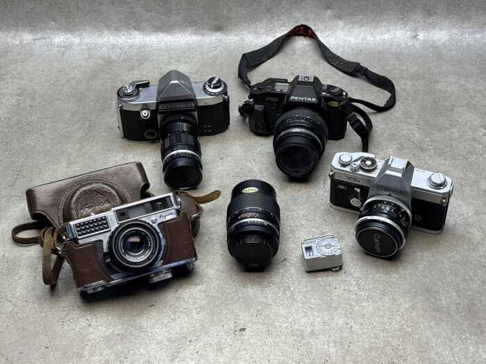 Four film cameras including Canon
