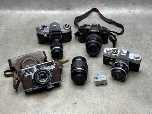 Four film cameras including Canon