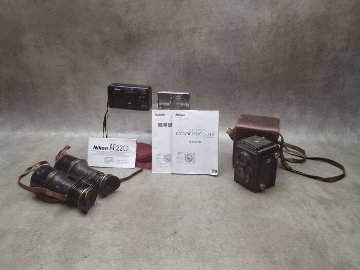 Three cameras, plus antique binoculars