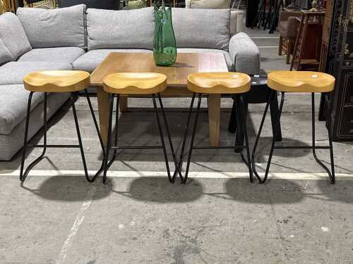 Set of four timber saddle bar stools