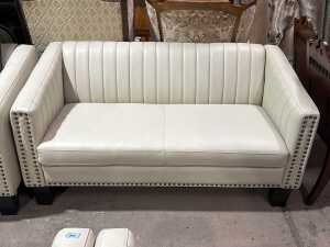 Contemporary cream upholstered two-seater sofa