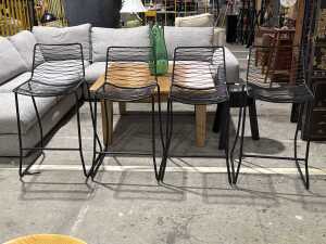 Set of four matte black metal wire bar stools