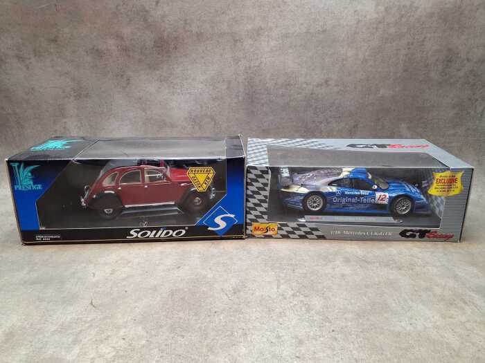 Two die cast model cars, including Prestige and Maisto