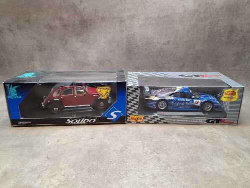 Two die cast model cars, including Prestige and Maisto