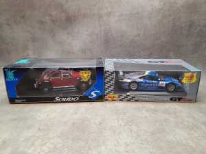 Two die cast model cars, including Prestige and Maisto