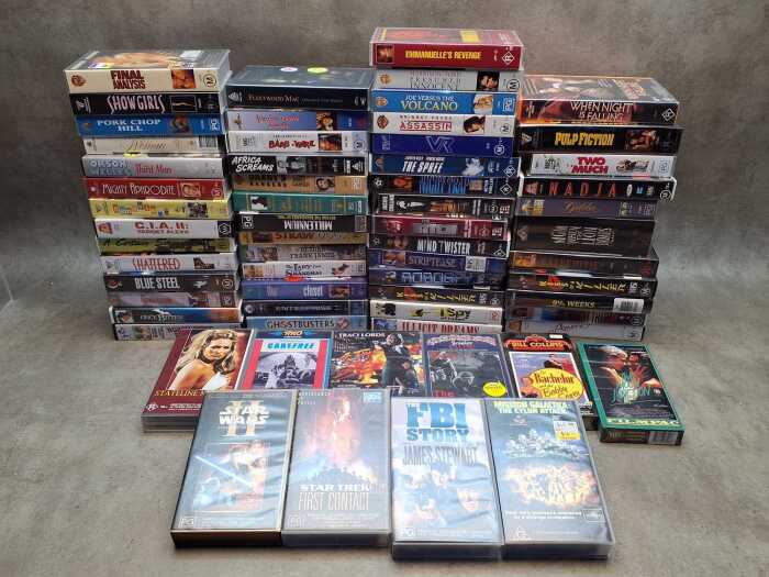 VHS video tapes, mostly nostalgia titles, including Joe Versus the Volcano