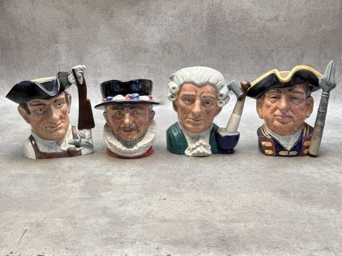 Four Royal Doulton Toby jugs