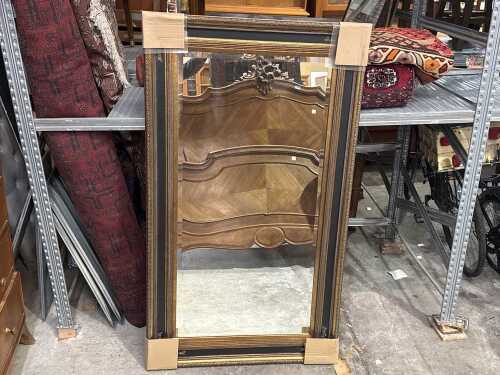 Brass coloured wall mirror
