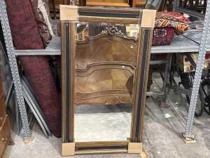 Brass coloured wall mirror