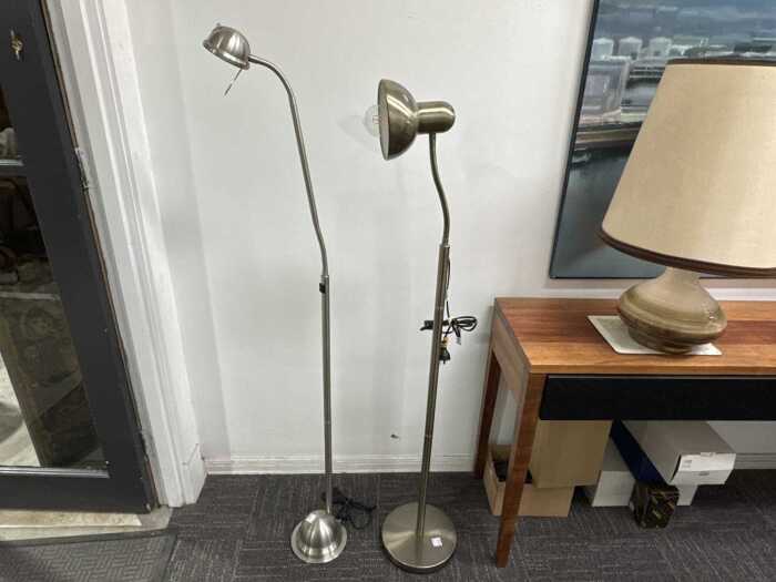 Two brushed metal floor lamps with adjustable goosenecks