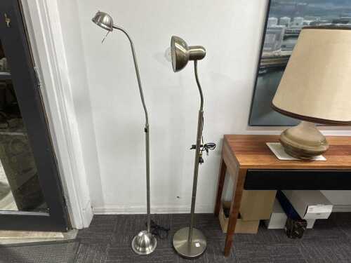 Two brushed metal floor lamps with adjustable goosenecks