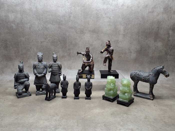 Asian decorative figures, including Chinese Terracotta Warriors