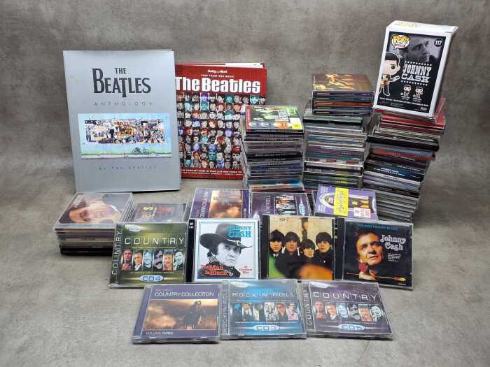 CD collection, together with two Beatles books and a Pop! vinyl figure