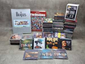 CD collection, together with two Beatles books and a Pop! vinyl figure