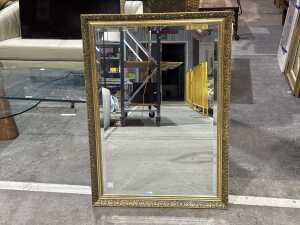 Ornate gilded framed bevelled edge mirror
