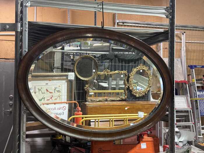 Antique oval wall mirror with timber frame