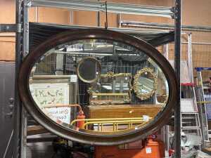 Antique oval wall mirror with timber frame