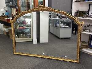Ornate gilt framed over mantle arched wall mirror