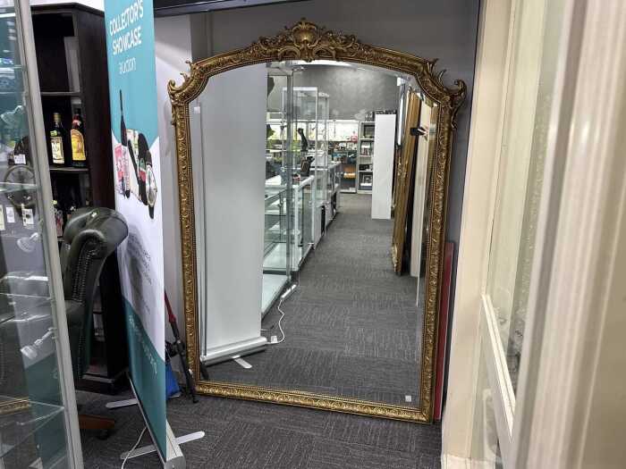 Ornate gilt framed wall mirror