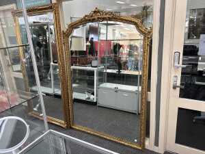 Ornate gilt framed wall mirror