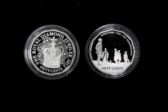 Two 50c silver proof coins totalling $1 and 36.48g 99.9% pure silver