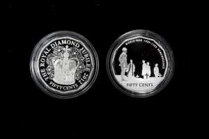 Two 50c silver proof coins totalling $1 and 36.48g 99.9% pure silver
