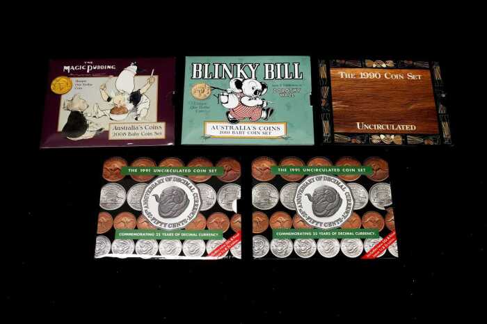Three eight-coin uncirculated sets and two six-coin uncirculated sets