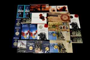 Group of remembrance themed collectable coins and PNCs