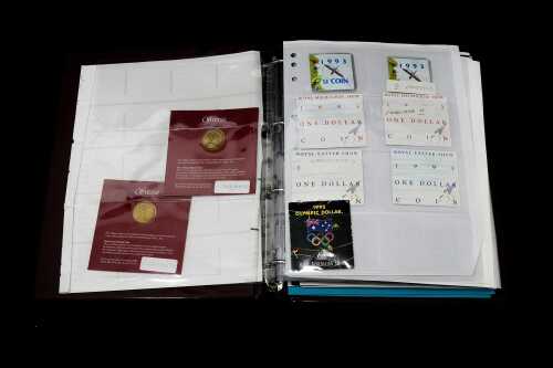 Album of collectable $1 coins