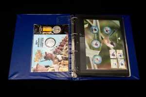 Album of collectable coins and PNCs
