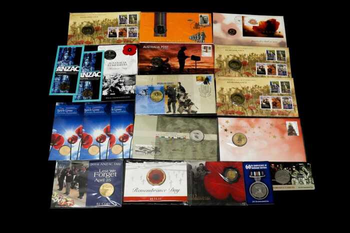 Group of remembrance themed collectable coins and PNCs