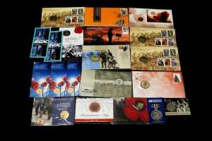 Group of remembrance themed collectable coins and PNCs