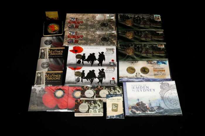Group of Remembrance themed collectable coins and PNCs