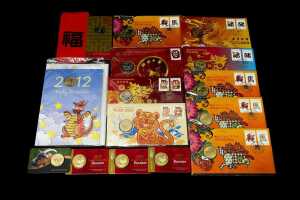 Group of Lunar New Year themed collectable coins and PNCs