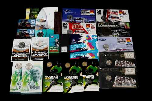 Group of assorted motor racing and sporting themed collectable coins and PNCs
