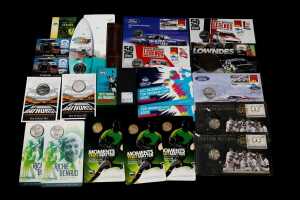 Group of assorted motor racing and sporting themed collectable coins and PNCs