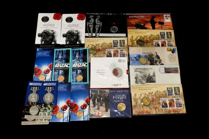 Group of remembrance themed collectable coins and PNCs