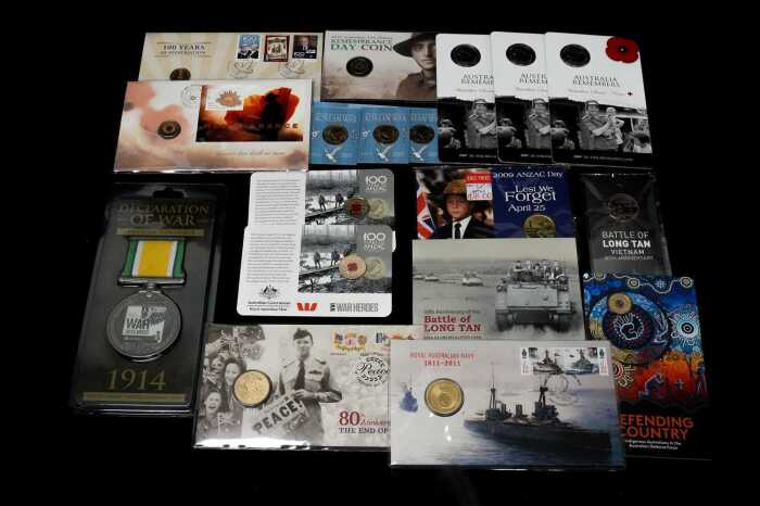 A group of Australian PNCs and coloured $2 coins, Remembrance themes.