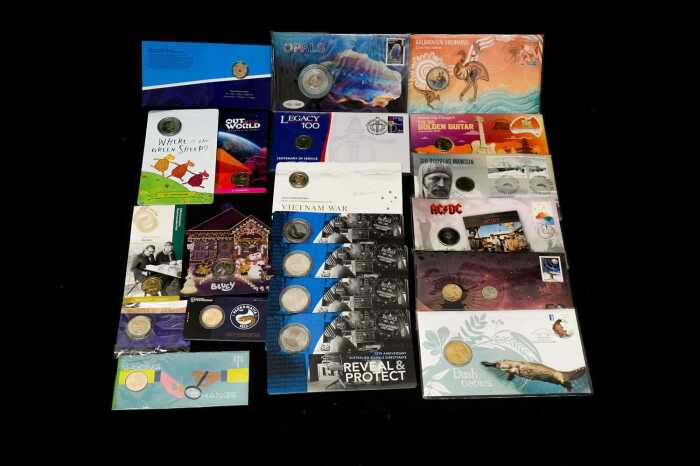 A group of uncirculated collectable coins and Philatelic Numismatic cards (PNCs)
