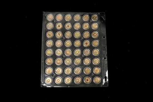 A card of 48 mostly coloured $2 coins