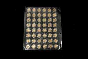 A card of 48 mostly coloured $2 coins