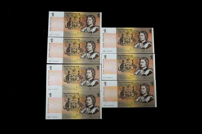 A group of Australian $1 paper bank notes