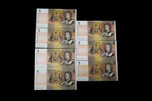 A group of Australian $1 paper bank notes