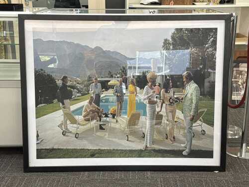After Slim Aarons, Palm Springs Party. Framed reproduction print on paper