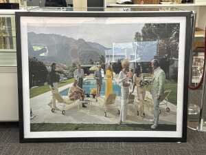 After Slim Aarons, Palm Springs Party. Framed reproduction print on paper