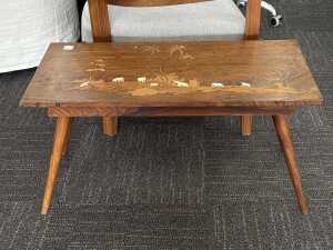 Timber coffee table with intricate inlay elephant and palm tree scenes